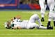 Aug 24, 2013; East Rutherford, NJ, USA; New York Jets quarterback Mark Sanchez (6) lies injured on the field after taking a hit from New York Giants linebacker Mark Herzlich (not pictured) during the fourth quarter of a preseason game at MetLife Stadium. Mandatory Credit: Brad Penner-USA TODAY Sports