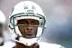 EAST RUTHERFORD, NJ - SEPTEMBER 8: Geno Smith #7 of the New York Jets walks to the sidelines during their game against the Tampa Bay Buccaneers at MetLife Stadium on September 8, 2013 in East Rutherford, New Jersey. (Photo by Jeff Zelevansky/Getty Images)