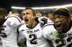 TUSCALOOSA, AL - NOVEMBER 10: Quarterback Johnny Manziel #2, defensive back Dustin Harris #22 and wide receiver Kenric McNeal #5 of the Texas A&M Aggies celebrate after the game against the Alabama Crimson Tide Texas A&M Aggies at Bryant-Denny Stadium on November 10, 2012 in Tuscaloosa, Alabama. The Aggies beat the Crimson Tide 29-24. (Photo by Mike Zarrilli/Getty Images)
