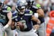 Sep 8, 2013; Charlotte, NC, USA; Seattle Seahawks quarterback Russell Wilson (3) scrambles during the game against the Carolina Panthers at Bank of America Stadium. Mandatory Credit: Sam Sharpe-USA TODAY Sports