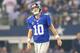 ARLINGTON, TX - SEPTEMBER 08: Quarterback Eli Manning #10 of the New York Giants reacts in the first quarter against the Dallas Cowboys in the first half on September 8, 2013 at AT&T Stadium in Arlington, Texas. (Photo by Ronald Martinez/Getty Images)