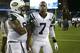 FOXBORO, MA - SEPTEMBER 12: Geno Smith #7 of the New York Jets is consoled by Damon Harrison #94 after a loss to the New England Patriots at Gillette Stadium on September 12, 2013 in Foxboro, Massachusetts. (Photo by Jim Rogash/Getty Images)
