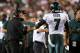 LANDOVER, MD - SEPTEMBER 09: Head coach Chip Kelly of the Philadelphia Eagles smiles as he bumps fists with quarterback Michael Vick #7 in the first half against the Washington Redskins at FedExField on September 9, 2013 in Landover, Maryland. (Photo by Rob Carr/Getty Images)