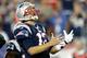 FOXBORO, MA - SEPTEMBER 12: Quarterback Tom Brady #12 of the New England Patriots reacts after an incomplete pass in the second quarter while taking on the New York Jets at Gillette Stadium on September 12, 2013 in Foxboro, Massachusetts. (Photo by Jim Rogash/Getty Images)