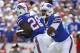 Sep 8, 2013; Orchard Park, NY, USA; Buffalo Bills quarterback EJ Manuel (3) hands off to running back C.J. Spiller (28) against the New England Patriots during the first half at Ralph Wilson Stadium. Patriots beat the Bills 23-21. Mandatory Credit: Kevin Hoffman-USA TODAY Sports