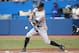 TORONTO, CANADA - AUGUST 26: Brett Gardner #11 of the New York Yankees hits a single in the first inning during MLB game action against the Toronto Blue Jays on August 26, 2013 at Rogers Centre in Toronto, Ontario, Canada. (Photo by Tom Szczerbowski/Getty Images)