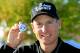 LAKE FOREST, IL - SEPTEMBER 13: Jim Furyk holds up his ball with a '59' on it after shooting a 12 under round of 59 during the Second Round of the BMW Championship at Conway Farms Golf Club on September 13, 2013 in Lake Forest, Illinois. (Photo by Sam Greenwood/Getty Images)