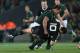 AUCKLAND, NEW ZEALAND - SEPTEMBER 14: Bismarck Du Plessis of South Africa hits Dan Carter of the All Blacks during The Rugby Championship match between the New Zealand All Blacks and the South African Springboks at Eden Park on September 14, 2013 in Auckland, New Zealand. (Photo by Sandra Mu/Getty Images)