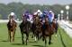 DONCASTER, ENGLAND - SEPTEMBER 15: Mickael Barzalona riding Encke win The Ladbrokes St. Leger Stakes from Camelot (2L) at Doncaster racecourse on September 15, 2012 in Doncaster, England. (Photo by Alan Crowhurst/Getty Images)