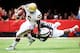 LINCOLN, NE - SEPTEMBER 14: Running back Jordon James #6 of the UCLA Bruins is tackled by linebacker Michael Rose #15 of the Nebraska Cornhuskers during their game at Memorial Stadium on September 14, 2013 in Lincoln, Nebraska. (Photo by Eric Francis/Getty Images)