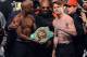 LAS VEGAS, NV - SEPTEMBER 13: CEO of Mayweather Promotions Leonard Ellerbe (C) looks on as boxer Floyd Mayweather Jr. (L) tries to get boxer Canelo Alvarez (R) to hold a WBC belt as they pose during the official weigh-in for their bout at the MGM Grand Garden Arena on September 13, 2013 in Las Vegas, Nevada. The fighters will meet in a WBC/WBA 154-pound title fight on September 14 in Las Vegas. (Photo by Ethan Miller/Getty Images)