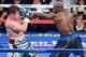 LAS VEGAS, NV - SEPTEMBER 14: (R-L) Floyd Mayweather Jr. throws a left at Canelo Alvarez during their WBC/WBA 154-pound title fight at the MGM Grand Garden Arena on September 14, 2013 in Las Vegas, Nevada. (Photo by Ethan Miller/Getty Images)