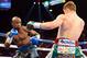 Sep 14, 2013; Las Vegas, NV, USA; Floyd Mayweather Jr. (blue gloves) and Canelo Alvarez battle during their during their WBC and WBA super welterweight titles fight at MGM Grand Garden Arena. Mandatory Credit: Jayne Kamin-Oncea-USA TODAY Sports