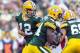 Aug 9, 2013; Green Bay, WI, USA; Green Bay Packers quarterback Aaron Rodgers (12) hands the football off to running back James Starks (44) during the first quarter against the Arizona Cardinals at Lambeau Field. Mandatory Credit: Jeff Hanisch-USA TODAY Sports