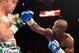 Sep 14, 2013; Las Vegas, NV, USA; Floyd Mayweather Jr. (blue gloves) and Canelo Alvarez battle it during their during their WBC and WBA super welterweight titles fight at MGM Grand Garden Arena. Mandatory Credit: Jayne Kamin-Oncea-USA TODAY Sports