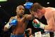Sep 14, 2013; Las Vegas, NV, USA; Floyd Mayweather Jr. (blue gloves) and Canelo Alvarez battle it during their during their WBC and WBA super welterweight titles fight at MGM Grand Garden Arena. Mandatory Credit: Jayne Kamin-Oncea-USA TODAY Sports