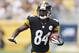 Sep 8, 2013; Pittsburgh, PA, USA; Pittsburgh Steelers wide receiver Antonio Brown (84) runs after a pass reception against the Tennessee Titans during the first quarter at Heinz Field. The Tennessee Titans won 16-9. Mandatory Credit: Charles LeClaire-USA TODAY Sports
