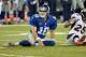 Sep 15, 2013; East Rutherford, NJ, USA; New York Giants quarterback Eli Manning (10) reacts after throwing an incomplete pass against the Denver Broncos in the 4th quarter during the game at MetLife Stadium. Mandatory Credit: Robert Deutsch-USA TODAY Sports
