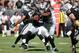 Sep 15, 2013; Oakland, CA, USA; Jacksonville Jaguars defensive end Jeremy Mincey (94) sacks Oakland Raiders quarterback Terrelle Pryor (2) during the third quarter at O.co Coliseum. The Oakland Raiders defeated the Jacksonville Jaguars 19-9. Mandatory Credit: Kelley L Cox-USA TODAY Sports