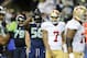 Sep 15, 2013; Seattle, WA, USA; Seattle Seahawks defensive end Cliff Avril (56) shows the safety sign during the 1st half against the San Francisco 49ers at CenturyLink Field. Mandatory Credit: Steven Bisig-USA TODAY Sports
