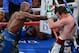 LAS VEGAS, NV - SEPTEMBER 14: (L-R) Floyd Mayweather Jr. throws a right at Canelo Alvarez during their WBC/WBA 154-pound title fight at the MGM Grand Garden Arena on September 14, 2013 in Las Vegas, Nevada. (Photo by Ethan Miller/Getty Images)