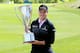 LAKE FOREST, IL - SEPTEMBER 16: Zach Johnson holds the J.K. Wadley Trophy after winning the BMW Championship at Conway Farms Golf Club on September 16, 2013 in Lake Forest, Illinois. Johnson finished with a score of -16. (Photo by Sam Greenwood/Getty Images)
