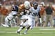 AUSTIN, TX - SEPTEMBER 14: Johnathan Gray #32 of the Texas Longhorns tries to break free against the Mississippi Rebels defense on September 14, 2013 at Darrell K Royal-Texas Memorial Stadium in Austin, Texas. (Photo by Cooper Neill/Getty Images)
