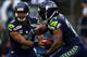 SEATTLE, WA - SEPTEMBER 15: Russell Wilson #3 of the Seattle Seahawks hands the ball off turnover Marshawn Lynch #24 of the Seattle Seahawks during their game at Qwest Field on September 15, 2013 in Seattle, Washington. (Photo by Jonathan Ferrey/Getty Images)