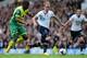 LONDON, ENGLAND - SEPTEMBER 14: Sébastien Bassong of Norwich City pulls on the shirt of Christian Eriksen of Spurs during the Barclays Premier League match between Tottenham Hotspur and Norwich City at White Hart Lane on September 14, 2013 in London, England. (Photo by Jamie McDonald/Getty Images)