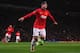 MANCHESTER, ENGLAND - SEPTEMBER 17: Wayne Rooney of Manchester United celebrates scoring his team's third goal during the UEFA Champions League Group A match between Manchester United and Bayer Leverkusen at Old Trafford on September 17, 2013 in Manchester, England. (Photo by Michael Regan/Getty Images)