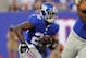 Aug 18, 2013; East Rutherford, NJ, USA; New York Giants running back David Wilson (22) runs the ball against the Indianapolis Colts during the first quarter of a preseason game at MetLife Stadium. Mandatory Credit: Brad Penner-USA TODAY Sports
