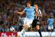 MANCHESTER, ENGLAND - AUGUST 19: Edin Dzeko of Manchester City beats Mathieu Debuchy of Newcastle United during the Barclays Premier League match between Manchester City and Newcastle United at the Etihad Stadium on August 19, 2013 in Manchester, England. (Photo by Alex Livesey/Getty Images)