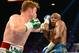 Sep 14, 2013; Las Vegas, NV, USA; Floyd Mayweather Jr. (blue gloves) and Canelo Alvarez battle at their WBC and WBA super welterweight titles fight at MGM Grand Garden Arena. Mayweather won by a majority decision. Mandatory Credit: Jayne Kamin-Oncea-USA TODAY Sports