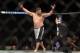 Apr 27, 2013; Newark, NJ, USA; Roy Nelson (white shorts) celebrates defeating Cheick Kongo (yellow and grey shorts) during UFC 159 at the Prudential Center. Mandatory Credit: Brad Penner-USA TODAY Sports