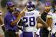 DETROIT, MI - SEPTEMBER 08: Head coach Leslie Frazier of the Minnesota Vikings congratulates Adrian Peterson #28 on his second quarter touchdown while playing the Detroit Lions at Ford Field on September 8, 2013 in Detroit, Michigan. (Photo by Gregory Shamus/Getty Images)