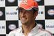 SINGAPORE - SEPTEMBER 18: Formula One driver Jenson Button of Great Britain and McLaren speaks to the media during 'The One Legacy Tour' at ION Orchard on September 18, 2013 in Singapore. (Photo by Suhaimi Abdullah/Getty Images)