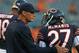 CHICAGO, IL - AUGUST 29: Head coach Marc Trestman of the Chicago Bears pats Sherrick McManis #27 on the back during warm-ups before taking on the Cleveland Browns at Soldier Field on August 29, 2013 in Chicago, Illinois. The Browns defeated the Bears 18-16. (Photo by Jonathan Daniel/Getty Images)