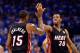 OKLAHOMA CITY, OK - JUNE 14: Mario Chalmers #15 and Norris Cole #30 of the Miami Heat celebrate a play in the first half while taking on the Oklahoma City Thunder in Game Two of the 2012 NBA Finals at Chesapeake Energy Arena on June 14, 2012 in Oklahoma City, Oklahoma. NOTE TO USER: User expressly acknowledges and agrees that, by downloading and or using this photograph, User is consenting to the terms and conditions of the Getty Images License Agreement. (Photo by Ronald Martinez/Getty Images)