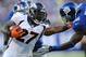 EAST RUTHERFORD, NJ - SEPTEMBER 15: Knowshon Moreno #27 of the Denver Broncos runs in for a touchdown past Antrel Rolle #26 of the New York Giants at MetLife Stadium on September 15, 2013 in East Rutherford, New Jersey. (Photo by Maddie Meyer/Getty Images)