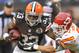Dec 9, 2012; Cleveland, OH, USA; Cleveland Browns running back Trent Richardson (33) runs against Kansas City Chiefs defensive back Tysyn Hartman (31) in the fourth quarter at Cleveland Browns Stadium. Mandatory Credit: David Richard-USA TODAY Sports