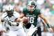 Sep 7, 2013; East Lansing, MI, USA;Michigan State Spartans quarterback Connor Cook (18) scrambles out of the pocket against South Florida Bulls defensive lineman Elkino Watson (53) during the 2nd half at Spartan Stadium. MSU won 21-6. Mandatory Credit: Mike Carter-USA TODAY Sports