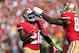 Sep 8, 2013; San Francisco, CA, USA; San Francisco 49ers tight end Vernon Davis (85) drums on the helmet of running back Frank Gore (21) after scoring a touchdown against the Green Bay Packers during the fourth quarter at Candlestick Park. The San Francisco 49ers defeated the Green Bay Packers 34-28. Mandatory Credit: Kelley L Cox-USA TODAY Sports