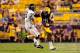 BATON ROUGE, LA - SEPTEMBER 14: Luke Wollet #39 of the Kent State Golden Flashes tries to tackle Anthony Jennings #10 of the LSU Tigers during a game at Tiger Stadium on September 14, 2013 in Baton Rouge, Louisiana. LSU defeated Kent State 45-13. (Photo by Stacy Revere/Getty Images)