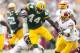 Sep 15, 2013; Green Bay, WI, USA; Green Bay Packers running back James Starks (44) rushes with the football as Washington Redskins cornerback David Amerson (39) defends during the third quarter at Lambeau Field. Green Bay won 38-20. Mandatory Credit: Jeff Hanisch-USA TODAY Sports