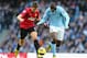 MANCHESTER, ENGLAND - DECEMBER 09: Yaya Toure of Manchester City competes with Michael Carrick of Manchester United during the Barclays Premier League match between Manchester City and Manchester United at the Etihad Stadium on December 9, 2012 in Manchester, England. (Photo by Clive Mason/Getty Images)