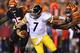 CINCINNATI, OH - SEPTEMBER 16: Ben Roethlisberger #7 of the Pittsburgh Steelers runs with the ball while defended by Michael Johnson #93 of the Cincinnati Bengals during the game at Paul Brown Stadium on September 16, 2013 in Cincinnati, Ohio. (Photo by Andy Lyons/Getty Images)