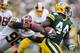 GREEN BAY, WI - SEPTEMBER 15: James Starks #44 of the Green Bay Packers rushes the ball and is pursued by Barry Cofield #96 of the Washington Redskins at Lambeau Field on September 15, 2013 in Green Bay, Wisconsin. The Packers defeated the Redskins 38-20. (Photo by Wesley Hitt/Getty Images)