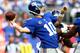 EAST RUTHERFORD, NJ - SEPTEMBER 15: Eli Manning #10 of the New York Giants passes the ball to Victor Cruz in the first quarter against the Denver Broncos at MetLife Stadium on September 15, 2013 in East Rutherford, New Jersey. (Photo by Elsa/Getty Images)