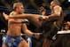Sep 21, 2013; Toronto, Ontario, CAN; Jon Jones connects on a kick against Alexander Gustafsson (left) during their Light Heavyweight Championship bout at UFC 165 at the Air Canada Centre. Mandatory Credit: Tom Szczerbowski-USA TODAY Sports