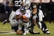 OAKLAND, CA - DECEMBER 06: Knowshon Moreno #27 of the Denver Broncos gets tackled by Philip Wheeler #52 and Brandian Ross #29 at Oakland-Alameda County Coliseum on December 6, 2012 in Oakland, California. (Photo by Ezra Shaw/Getty Images)